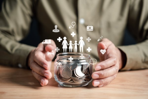 a man setting money aside in a bowl for his insurance needs